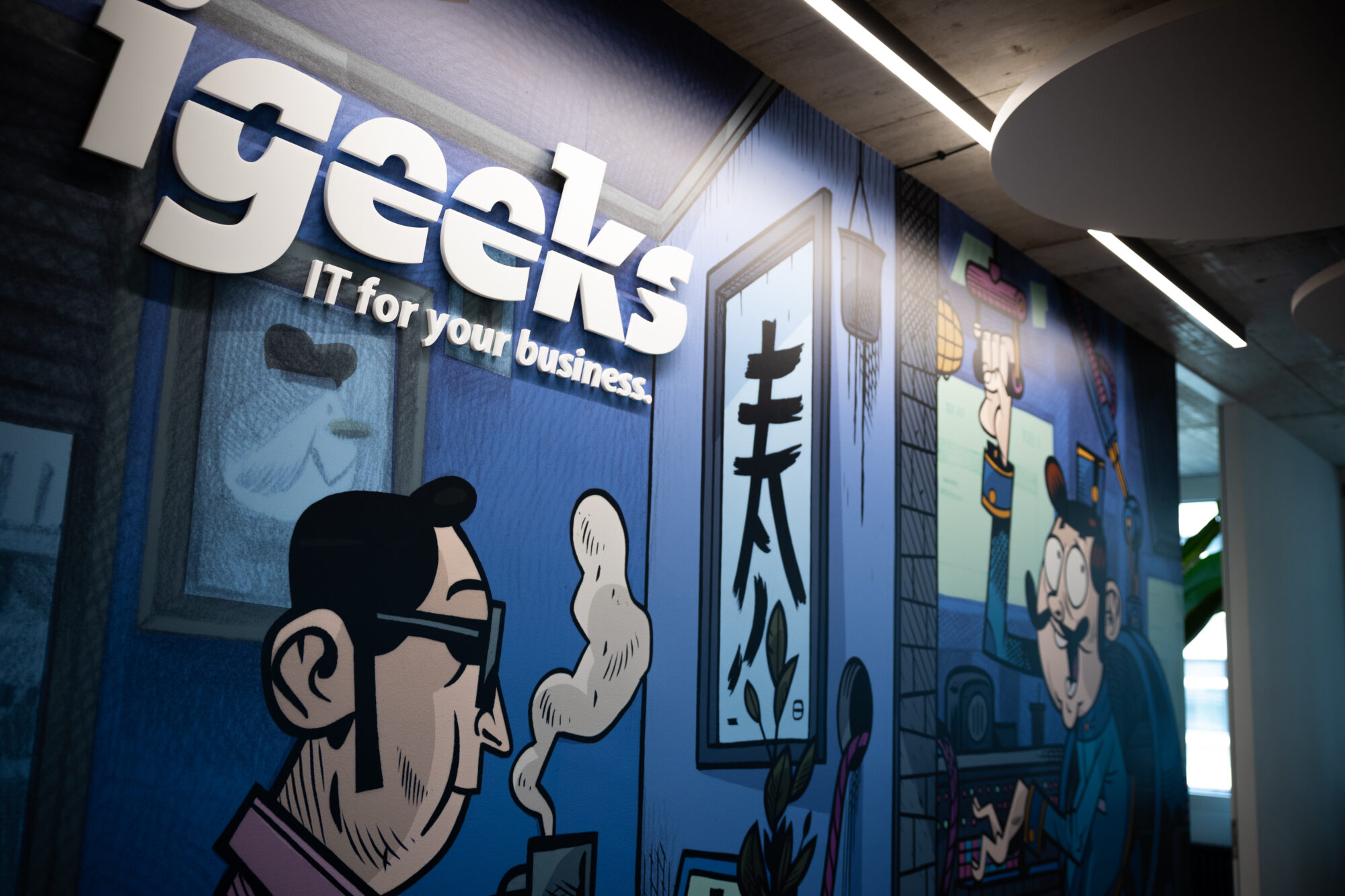 igeeks Büro in Zürich igeeks Logo und Wandgestaltung im Büro in Zürich